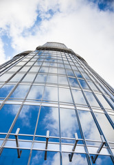 Fototapeta na wymiar Reflections in a modern skyscraper building