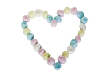 Close-up of a heart shape made from colorful cotton balls