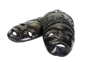 Close-up of two wooden masks