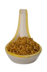 Close-up of spoon full of oat flakes
