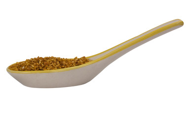 Close-up of spoon full of oat flakes