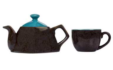 Close-up of a tea kettle with a tea cup