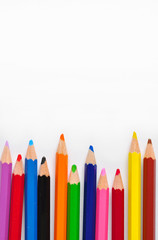 Close up of colored pencils isolated on white background
