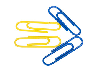 Close-up of paper clips arranged in arrow shape
