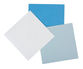 Close-up of three blank adhesive notes