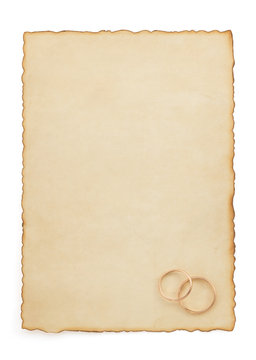 wedding ring and aged paper