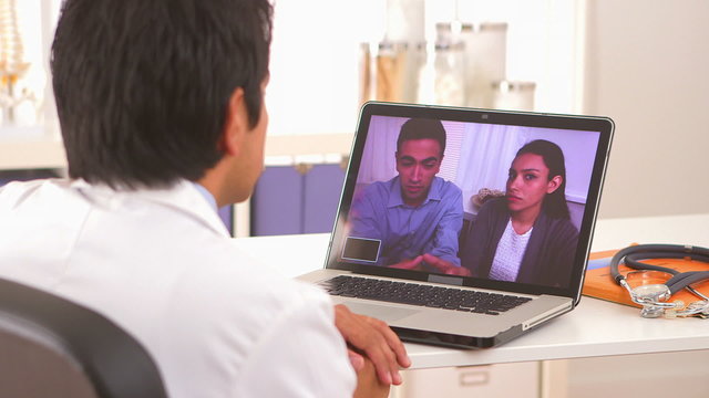 Mexican couple talking to doctor through video chat