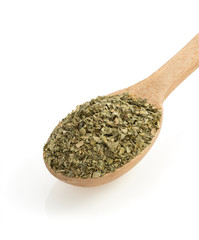 dried green spices in spoon