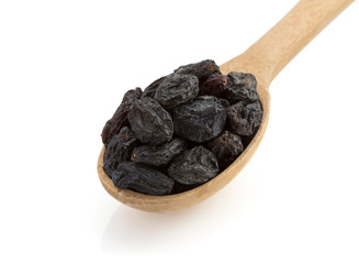 raisins in spoon on white