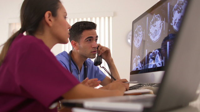 Hispanic doctors working in the office