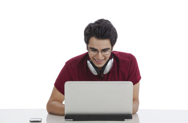 Happy man using a laptop