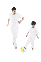 Happy father and son playing football