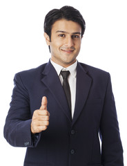 Businessman gesturing thumbs up sign