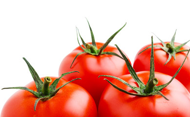 Red tomatoes isolated on white