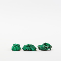 Three green gemstones