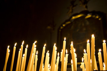 Burning votive candles in the Como Cathedral, Como, Lombardy, Italy