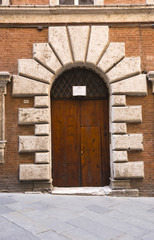 Closed door of a building, Siena, Siena Province, Tuscany, Italy