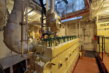 The diesel engine in the hold of the old ship