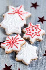 Gingerbread cookies over wooden background