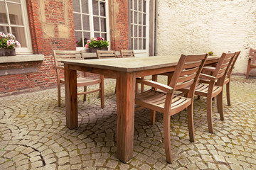 Table and chairs in patio - 58313565