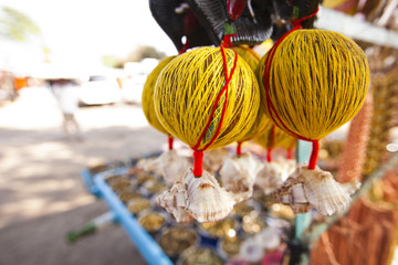 Coconuts tied up with threads at a market, Shani Shingnapur, Ahmadnagar, Maharashtra, India