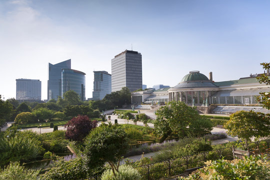 Vintage statues and modern buildings in the park