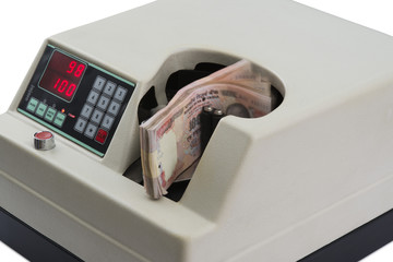 Close-up of a money counting machine