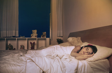 Girl sleeping on the bed