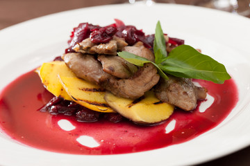 meat with mango and cherry sauce