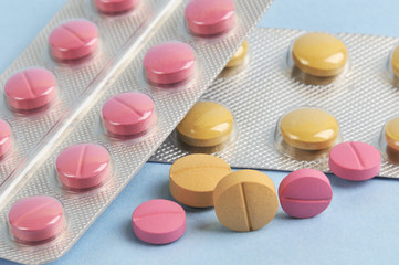 assortment of colorful pills and tablets in blister