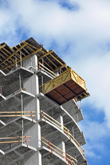 Building construction site work against blue sky