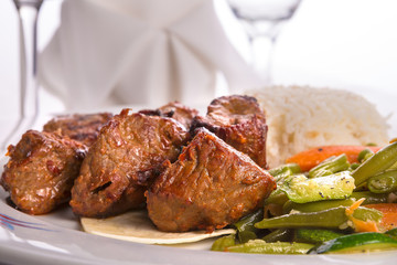 Macro Shots of Shish Kebabs and cooked Vegetables