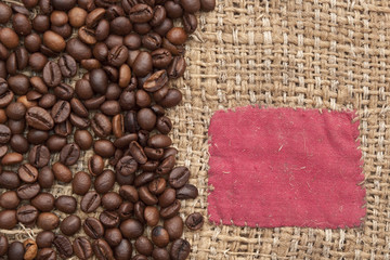 coffee beans on old canvas with red patch