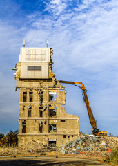 Demolition of a building with excavators