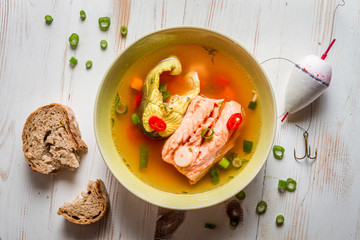 Salmon soup served with bread