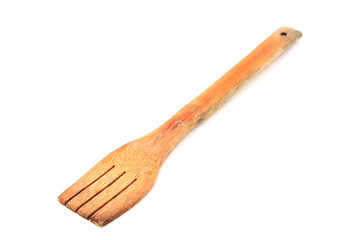 Wooden cooking spoon over white background