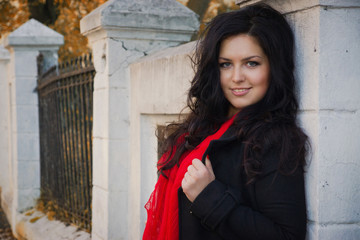 Pretty brunette in autumn park