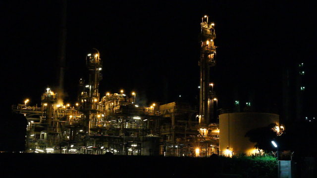 Oil refinery factory at night, Chonburi, Thailand.