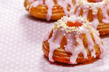 Traditional easter yeast cake covered with pink icing and color