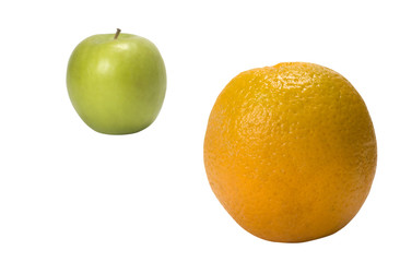 Close-up of an orange and a green apple