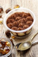 Fototapeta premium Tiramisu dessert on wooden table. Italian confectionery