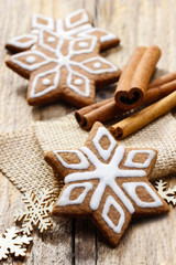 Christmas gingerbread cookies in star shape on rustic wood
