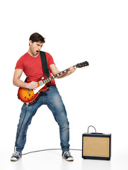 Obraz premium Guitarist man plays on the electric guitar