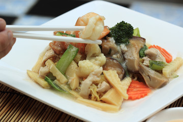 Chinese style stir fried yellow noodles with in gravy sauce