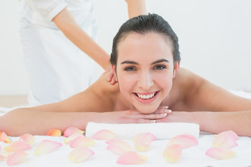 Obraz na płótnie Canvas Beautiful woman enjoying back massage at beauty spa