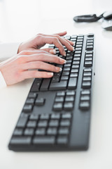 Close up of hands using computer keyboard