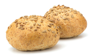 Round sandwich bun with sunflower seeds isolated on white backgr
