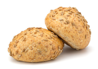 Round sandwich bun with sunflower seeds isolated on white backgr