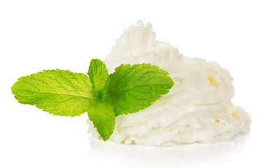 Whipped cream and spearmint leaves