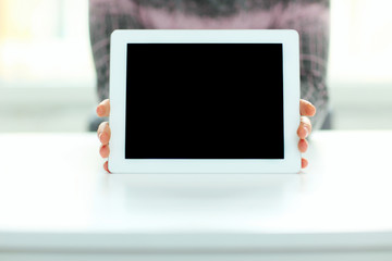 Closeup image of male hands showing display of tablet computer